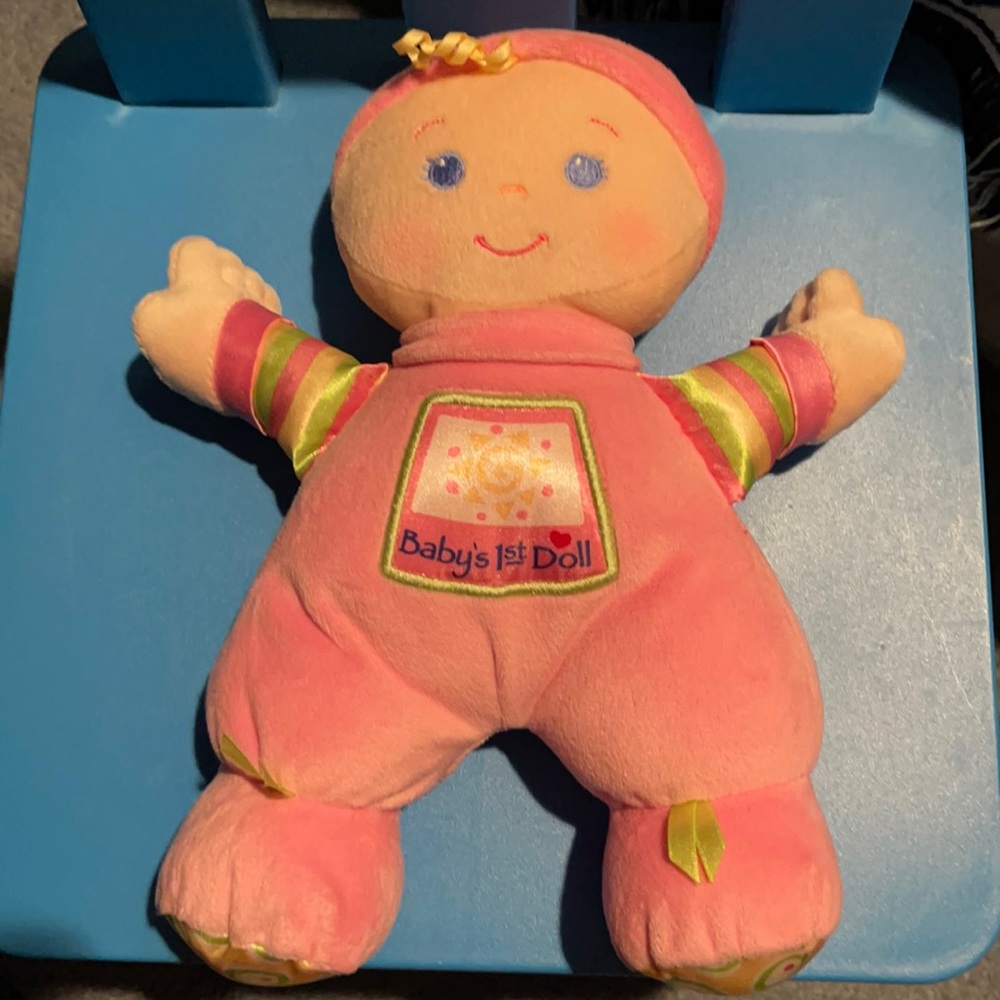 Baby’s first Doll. It’s a rattle. It’s new.